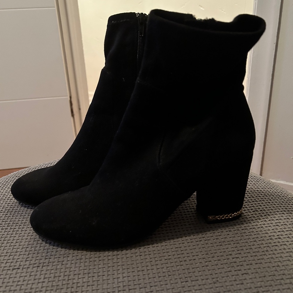 Black and gold heal boots